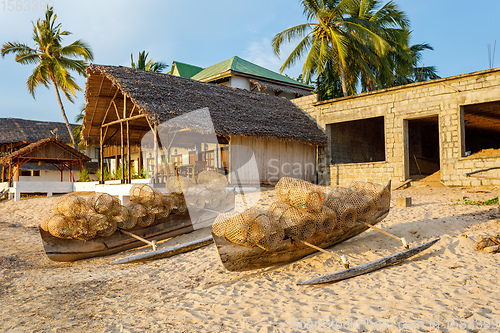 Image of traditional malagasy fishing boat with trap on beach