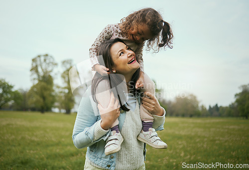 Image of Park, mother and girl sitting shoulders for happiness, bonding or care on nature walk together in spring. Woman, kid and happy for quality time, love or play on grass field for outdoor fun in Toronto
