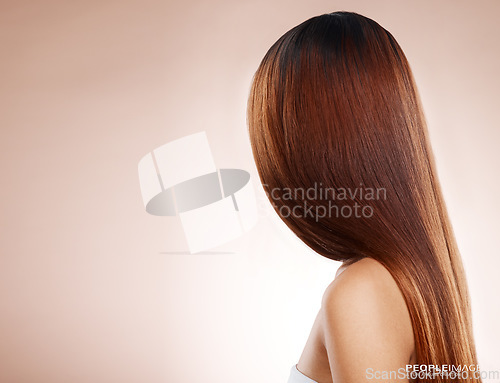 Image of Salon, hair and back of woman in studio for hair care, hair products and cosmetics on beige background. Beauty, balayage and girl with healthy, shine and long hair for hair salon, treatment and glow