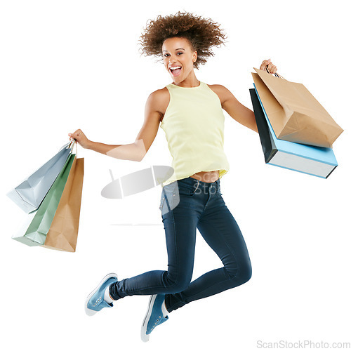 Image of Shopping, jump and woman with bags in studio after an amazing discount, sale or promotion. Energy, excited and portrait of female model from Brazil jumping after purchase isolated by white background