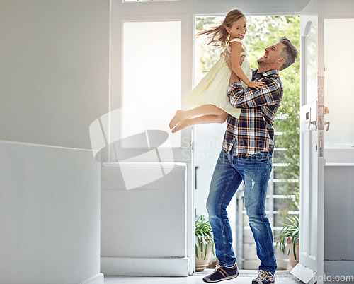 Image of Happy, freedom and dad carrying a girl in their modern family home for fun, care and love. Smile, happiness and mature man playing and bonding with his excited daughter in their house in Australia.