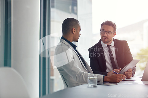 Image of Business. partner, planning and meeting with tablet for corporate strategy for online marketing. Men in a management discussion or consulting at table using internet for ideas, talking and teamwork