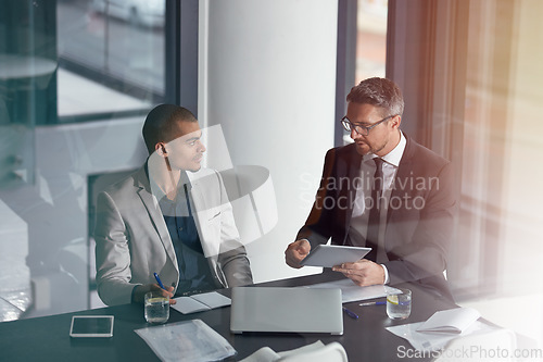 Image of Business people, tablet and planning during a meeting in office with accounting team. Men together in a discussion with documents, internet and ideas for management growth, development and mission