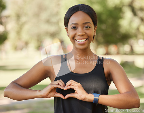 Image of Nature, fitness or black woman portrait with heart hand sign loves training, exercise, outdoor park workout in summer. Wellness, face or healthy girl with a calm, peaceful or happy smile in Nigeria