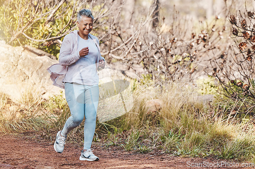 Image of Running, fitness and senior woman in nature for marathon training, sports health and retirement cardio in Indonesia. Smile, workout and happy elderly runner in a park or mountains for exercise