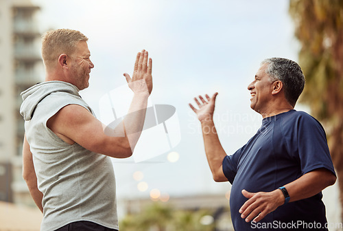 Image of High five, hand shake and senior friends in the city outdoor for a workout, exercise or running. Teamwork, motivation and success with a mature man and friend in celebration of a training goal