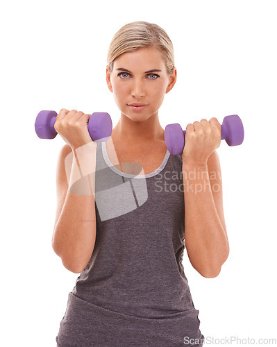 Image of Woman, studio portrait and dumbbells for fitness, muscle development and health by white background. Weightlifting model, focus face and isolated for training, workout and exercise with body goals