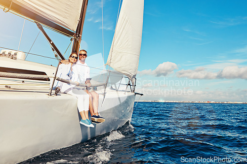 Image of Sea, portrait and mature couple on a yacht for adventure, holiday freedom and sailing trip. Travel, summer and man and woman with sunglasses on a boat in ocean for romantic seaside holiday in Greece.