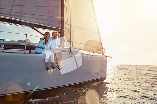 Image of Holiday, relax and couple on a yacht in the ocean for adventure, freedom and sailing trip. Travel, summer and mature man and woman on a boat in the sea for a romantic seaside vacation in Greece.