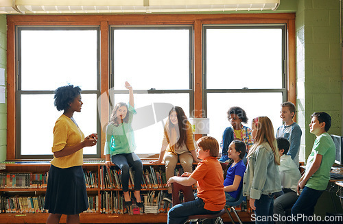 Image of Education, learning and student with questions for teacher in middle school classroom. Library, scholarship group and girl learner raising hand to answer question, studying or help with black woman.