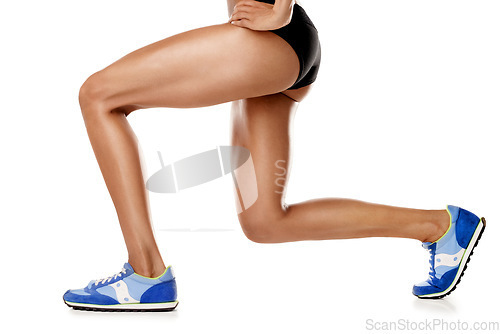 Image of Stretching legs, fitness and woman training isolated on a white background in studio. Warm up, exercise and athlete runner with a stretch before a workout, cardio or running on a studio background