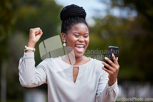 Image of Happy black woman, phone and winner for good news, promotion or business opportunity in the outdoors. African American woman with smile in excitement for bonus, achievement or victory on smartphone