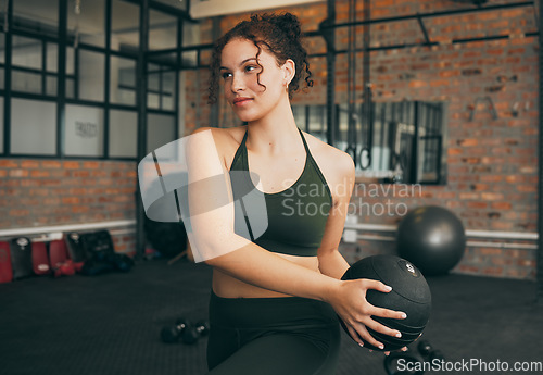 Image of Fitness, medicine ball and exercise of a woman at gym doing weight training for body wellness, health and energy. Sports female with equipment for strong muscle power, balance and healthy lifestyle