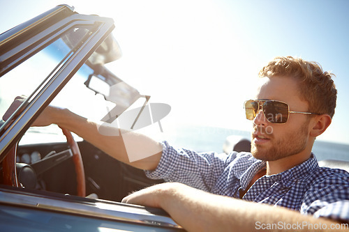Image of Car travel, road trip and relax man driving on holiday adventure, transportation journey or fun summer vacation. Lens flare, convertible automobile and driver on outdoor Australia countryside tour