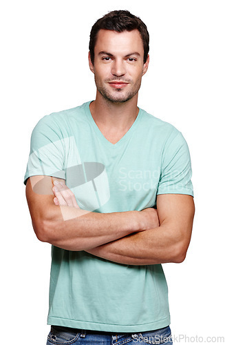 Image of Portrait, smile and man with arms crossed in studio isolated on a white background looking happy. Pride, cool and modern model male posing in casual clothes for trendy style and positive mindset