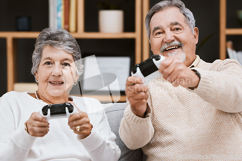 Image of Video game, portrait and senior couple on sofa relaxing, bonding and gaming together in living room. Happy, fun and elderly man and woman gamers in retirement playing online for entertainment at home