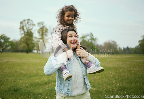 Image of Mother, girl and sitting on shoulders in park for happiness, bonding or care in nature, walk or together outdoor. Woman, child and game on holiday, love or play for adventure at field in Toronto