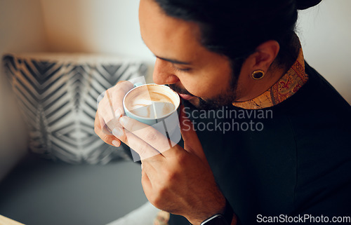 Image of Man, coffee and hands drinking or smelling aroma of caffeine, mocha or cappuccino relaxing at home. Happy male, person or guy holding a hot or warm beverage in calming relaxation at the house