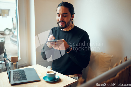 Image of Creative businessman, laptop and speaker phone for communication, social media or networking at cafe. Happy employee male with smile holding smartphone for voice call or startup at the coffee shop