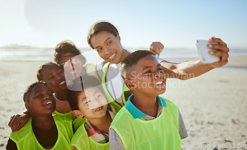 Image of People, phone and selfie for eco friendly environment with smile at the beach for recycling in nature. Happy woman with kids smiling for photo by the sandy ocean looking at smartphone with vests