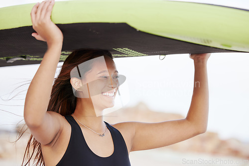 Image of Surfing, happy and woman at the beach with a board for water sports, fitness and summer freedom in Costa Rica. Smile, training and girl surfer with a paddle board for fun on a vacation at the sea