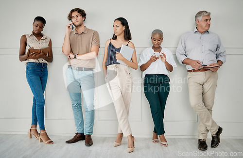 Image of Hiring, human resources or people in a waiting room for a marketing job interview at a office building. Onboarding, men and business women with career goals wait as a group for company hr manager