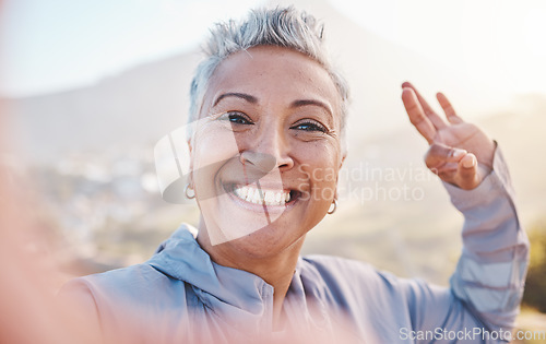 Image of Elderly woman runner, exercise selfie and smile in nature for fitness, wellness or self care with OK hand sign. Happy senior black woman, profile picture and running by mountains, outdoor and workout