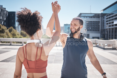 Image of Fitness, support and couple high five in the city for running motivation, training success and health goal. Teamwork, workout smile and runner man and woman with pride in exercise achievement