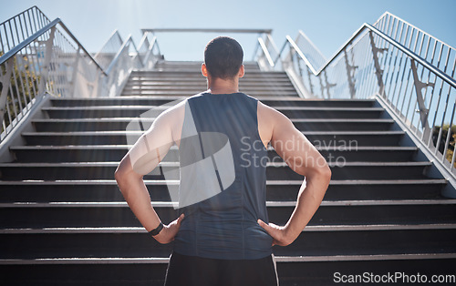 Image of Fitness, man and stairs for sport in city for running, exercise or healthy cardio preparation. Muscular sporty male ready for training, workout or sports run for wellness by staircase in urban town