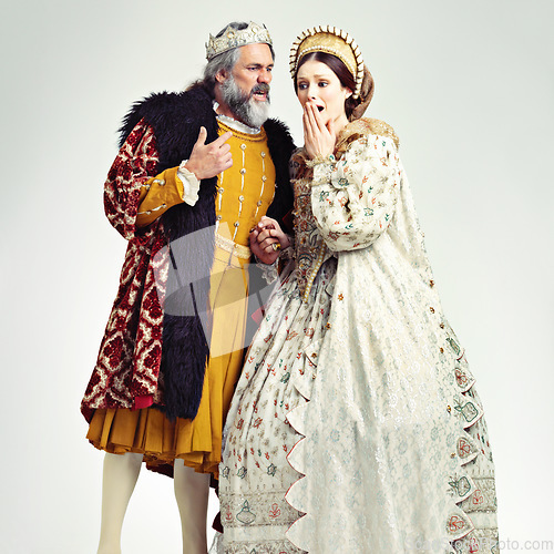 Image of King, queen and surprised in medieval costume for royal party, retro carnival and theatre fashion clothes in white background. Couple, shocked face and vintage renaissance standing isolated in studio