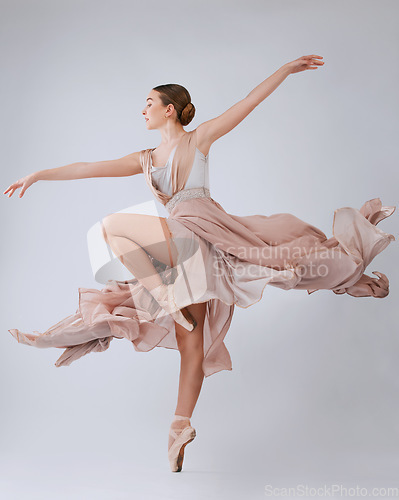 Image of Woman dancing, ballet and studio background with balance, art movement and beauty for training. Professional dancer, performance and finesse in class with strong body, wellness and focus for concert