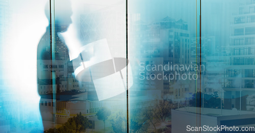 Image of Glass, silhouette and businessman with city overlay in office, writing and thinking, goal and strategy. Double exposure, shadow and man entrepreneur planning, creative and motivation for innovation