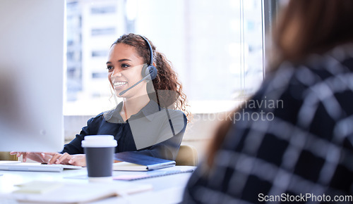 Image of Call center, customer service and support with a business black woman consulting in her telemarketing office. Computer, contact us or sales with a female employee working as a consultant in a company