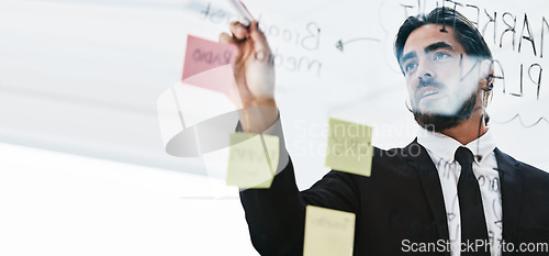 Image of Planning, brainstorming and businessman writing a schedule, idea and strategy on sticky note at work. Innovation, agenda and corporate employee with a goal, notes and ideas on a board for a solution