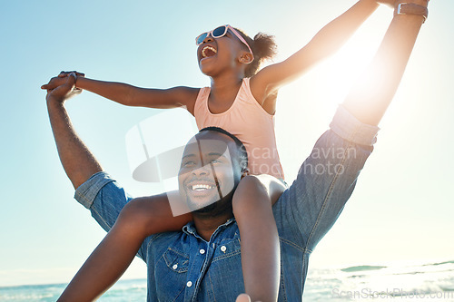 Image of Summer, beach and girl on shoulder of father enjoying holiday, vacation and freedom on weekend. Black family, travel and happy dad and child smile on adventure for bonding, relaxing and fun by ocean