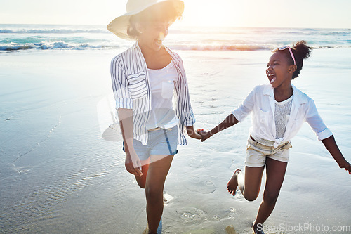 Image of Mother with girl kids holding hands on beach, happy outdoor and ocean waves, lens flare and fun together in nature. Laughing, black family on summer vacation and adventure, running woman and child