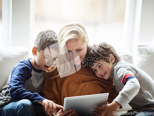 Image of Love, tablet and mother with children on sofa bonding, quality time and relax on weekend together. Happy, family home and mom and kids with digital tech for online games, learning and internet app