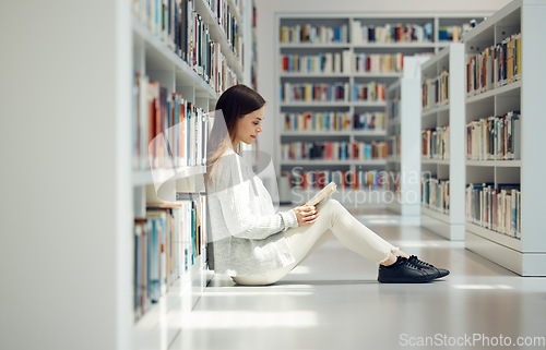 Image of Reading, knowledge and woman with a library book for education, research and learning at college. Scholarship, academy and student with books for studying information at university on campus