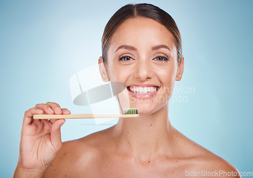 Image of Brushing teeth, dental and woman with toothbrush for teeth whitening and beauty, oral health and fresh breath with studio background. Mouth wellness, Invisalign portrait and clean with bamboo brush.