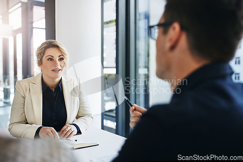 Image of Business people, meeting and discussion for idea, strategy or planning in marketing or advertising at the office. Employee workers in business meeting, conversation or interview for corporate plan