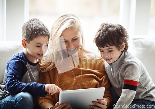 Image of Family, tablet and mother with children in living room bonding, quality time and relax on weekend. Love, family home and mom and kids with digital tech for online games, learning and social media app