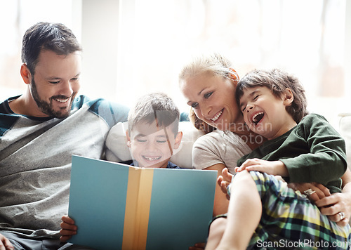 Image of Family, books and couple reading with kids on sofa, laughing for happy storytelling time at home. Love, learning and child development, man and woman with children reading book on couch with smile.