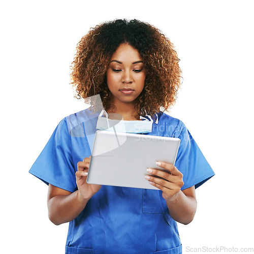 Image of Black woman, doctor and tablet in studio for typing, focus or communication on internet by white background. Isolated nurse, touchscreen tech or reading social media app, article or science news