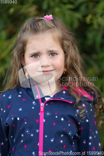 Image of Closeup portrait of sad cute little girl