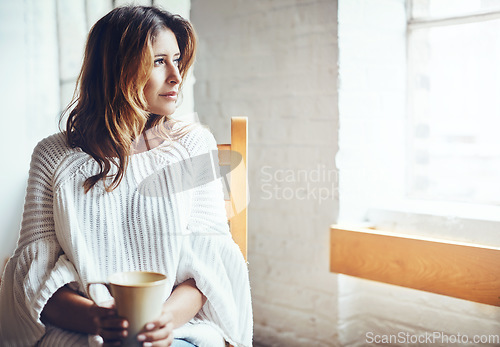 Image of Relax, thinking and woman drinking coffee in her home, content and quiet while daydreaming on wall background. Tea, comfort and calm female enjoying peaceful morning indoors while looking out window