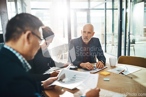 Image of Corporate, man and leader with team, meeting and brainstorming in office, planning schedule and marketing campaign. Team, manager and staff in workplace, sales growth and teamwork for advertising