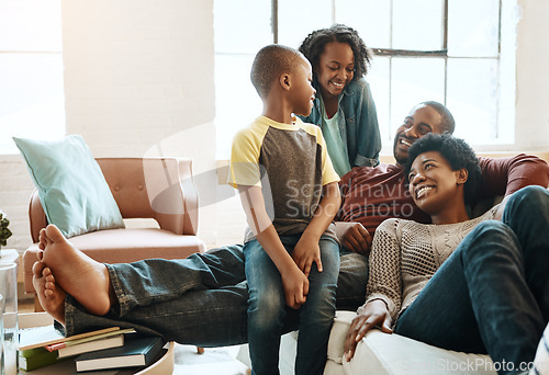 Image of Black family children, happy parents or relax African people smile together, bond and enjoy quality time. Happiness, love and young youth kids, easy father and mother lounge on home living room sofa