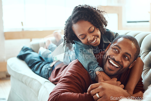 Image of Black family, love and father with girl on sofa enjoying quality time, bonding and relax together on weekend. Living room, happiness and daughter embrace, hugging and laying with dad on couch at home