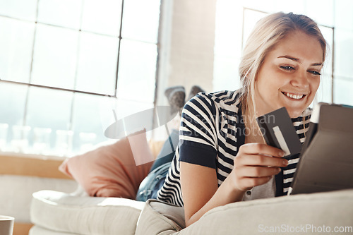 Image of Online shopping, credit card and woman on tablet happy with online order payment in lounge. Relaxed girl on home sofa checking e commerce transaction for banking card with satisfied smile.