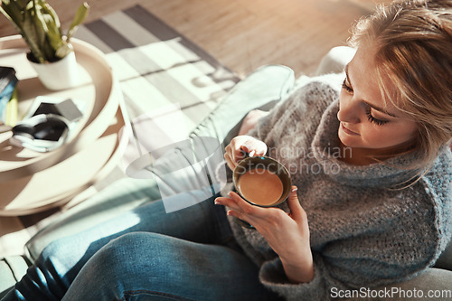 Image of Woman, coffee and calm on sofa in living room for peace and relaxing quality time. Female, drinking warm tea and thinking for lifestyle wellness vision, morning routine and rest on couch in home